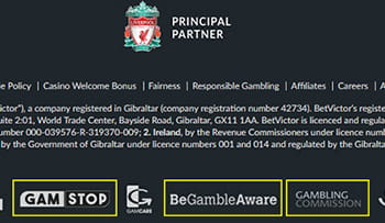 A screenshot of the BetVictor page footer featuring licence info and images of gambling support companies.