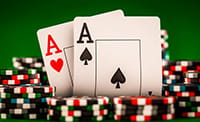 Two Aces surrounded by betting chips