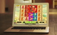 A slot game being played on a laptop